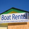 Boat rental sign shows boat hire